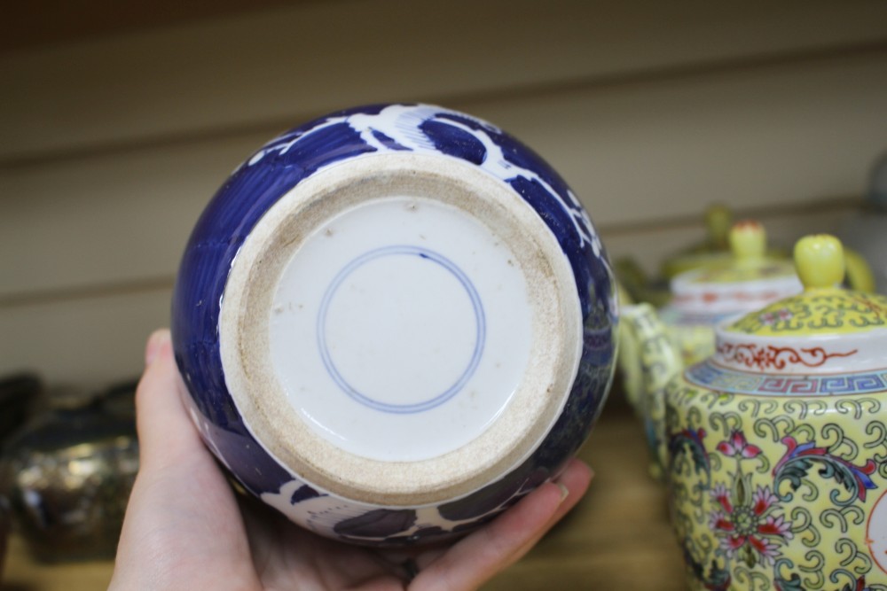 Three Chinese blue and white prunus pattern ginger jars, two other jars and ten assorted teapots